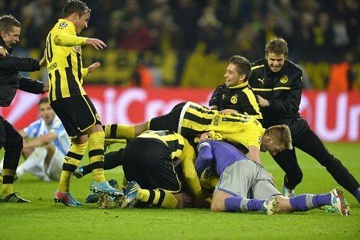 Dortmund's players celebrate in Dortmund, western Germany on April 9, 2013